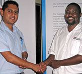 Branch committee member Lucky Penduka (right) thanks Alwin Lutchman after the presentation.